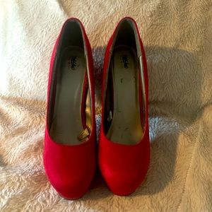 Ruby red platform pumps